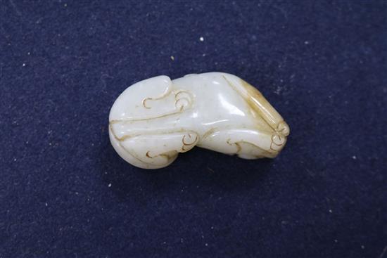 A Chinese pale celadon and russet jade figure of a lion-dog, Qing dynasty